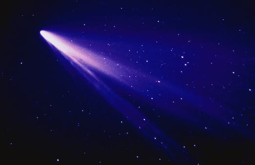 Shooting star in the night sky.