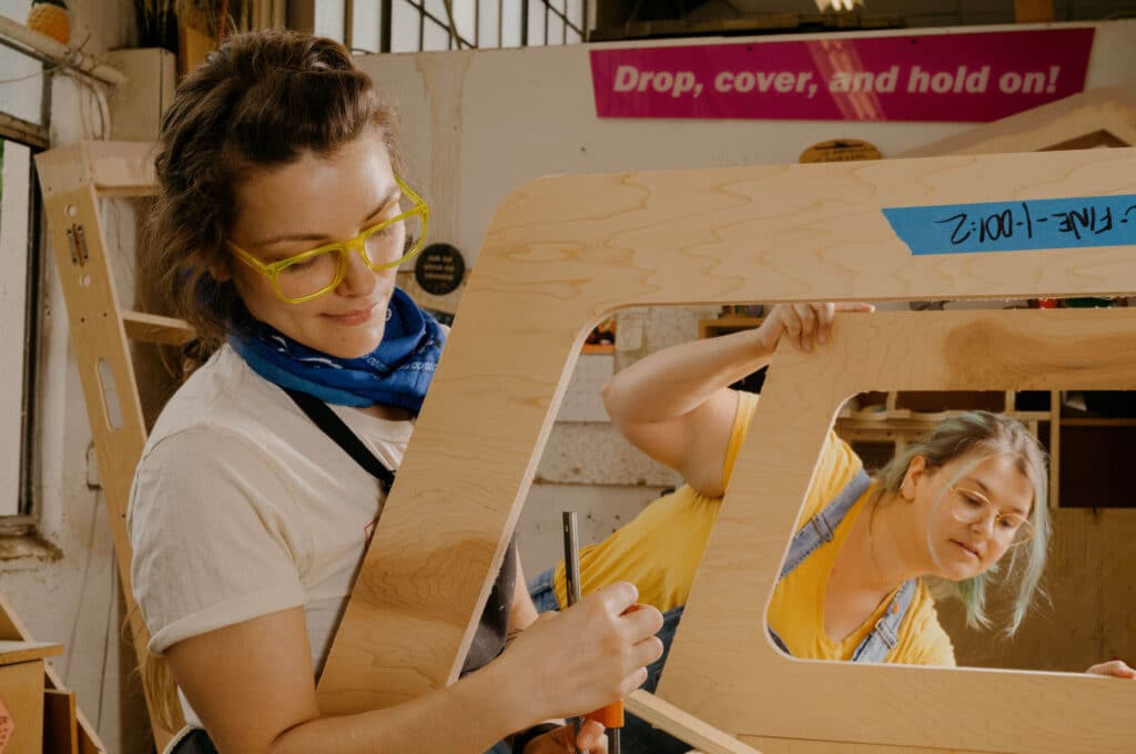 OMSI employee working on constructing a piece of an exhibit