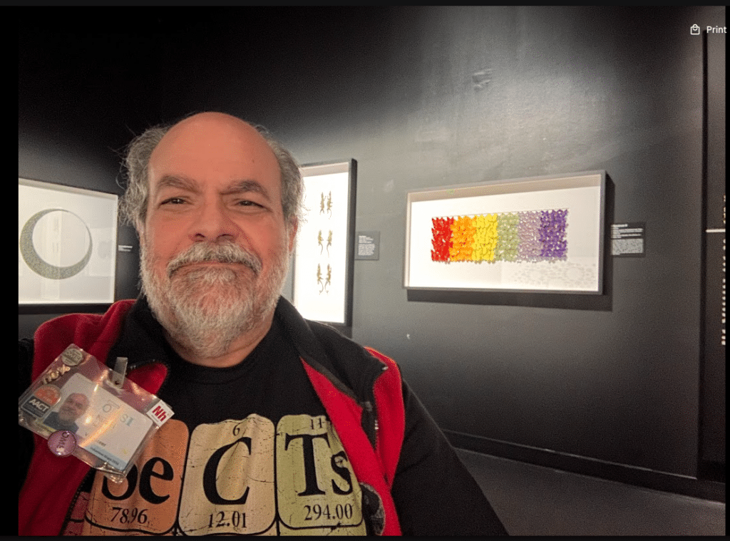 A picture of OMSI volunteer Nus Hisim in the Exquisite Creatures feature exhibit